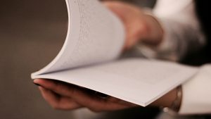 Student with a book, photo by Andisheh A